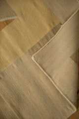 Hand woven Contemporary Kilim showing textured argyle diamond pattern and intact side cord selvage.
