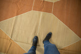 Modern Kilim with diamond argyle pattern in sand, copper, and ivory tones.