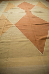 Modern argyle-inspired diamond pattern in alternating ivory, beige, and copper on the vintage Kilim.