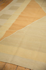 Hand woven contemporary kilim section: flatweave texture, geometric diamond pattern, ivory, sand, copper.