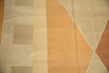 Modern geometric pattern in alternating copper and neutral tones on this Kilim carpet.