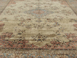 Vintage Romanian Tabriz rug, corner with dusty rose border and blue floral motifs.