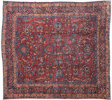 Vintage Laristan carpet with a burgundy field and expressive willow palmettes in shades of indigo and navy blue.