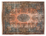 Vintage Kerman carpet with a dusty rose millefleur field, sky blue Rococo border, and a central cameo medallion.