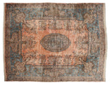 A central cameo medallion surrounded by a millefleur field and Rococo scroll borders in dusty rose and sky blue.