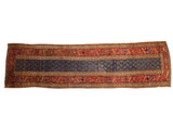 Antique Kurdish runner, navy blue field, repeating boteh motifs, wide terracotta border, circa 1870s.