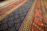 Antique Kurdish runner detail: navy geometric design, wide beige main border, terra cotta boteh.