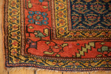 Antique Persian Kurdish rug corner, featuring an unusual wide gold border with nuanced motifs.