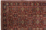 Intricate floral borders and original side cord selvage on a vintage Persian Mahal carpet.