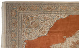 Elaborate corner spandrel of a Persian Tabriz rug with powder blue arabesques over a terra cotta field.
