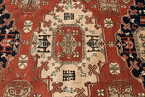 Vintage Meshkin carpet detail with geometric guls and stylized animals in brick red and ivory.