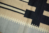 Vintage Contemporary Kilim rug detail: black, beige, grey abstract architectural geometric blocks.