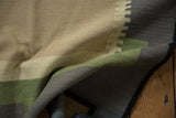 Folded vintage Kilim runner showing abstract modern geometric pattern and flat weave.