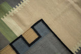 Hand woven contemporary Kilim runner corner, showing geometric blocks and intact black selvage.