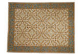 Vintage Alcaraz carpet with ivory field, gold floral tendrils, and a blue, gold dragon border.