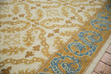 Vintage Spanish Alcaraz rug with scrolling gold tendrils and a blue dragon border.