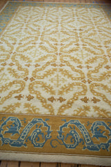 Saffron and sky blue dragon-inspired border detail of the vintage Alcaraz carpet.