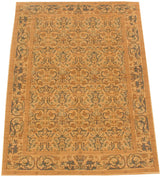 Pale gold and slate floral arabesques with a scrolling vase border on a vintage Spanish carpet.