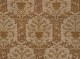 Vintage Spanish Arts and Crafts carpet's repeating coffee brown tree of life and vase motif.
