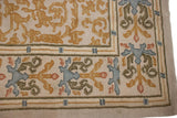 A vintage Spanish carpet corner showing the plush, even pile and simplistic plant design.