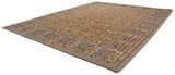 Angled view of a Spanish Arts and Crafts rug with dusty gold Rococo-style vinery.