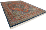 Crisp white fringe and deep denim blue outer edge of the vintage Indian Heriz rug.