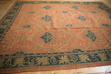 Vintage Indian Arts and Crafts Soumac rug corner, with terra cotta field and navy border.