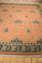 Hand woven Soumac carpet's natural fringe, dusty navy border, and terra cotta Arts and Crafts design.