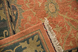 Arts and Crafts Soumac rug corner, hand woven terra cotta palmettes, navy border, original selvage.