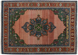 Vintage Indian Serapi carpet, dusty rose abrashed field, bold geometric medallion.