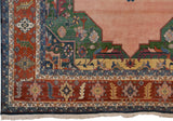 Vintage Indian Serapi rug border with madder root, denim blue stylized geometric patterns and fringe.