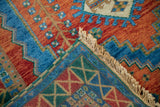 Hand-knotted back and fringe of vintage Indian Caucasian rug with geometric weave.