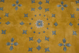 Vintage Art Deco Indian rug: saffron yellow full pile, powder blue bursting floral motifs.