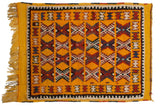 Vintage Murat square rug with geometric hourglass patterns in red and blue on a rich saffron yellow field.
