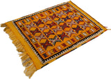 Angled perspective of a vintage Murat rug showing the full pile and bright saffron yellow fringe.
