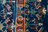 Sapphire blue, terra cotta, apricot, green hand-knotted geometric plant motifs and tribal border.