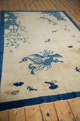 Elaborate blue phoenix motif on a hand-knotted antique pictorial Peking rug.