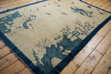 Antique Peking rug corner features blue rock bluffs, a house, and eucalyptus trees.