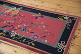 Vintage Chinese Nichols Art Deco runner with blush field, navy border, infinity knot, and butterfly.