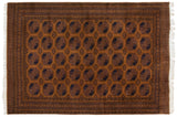 Hand-knotted vintage Pakistani Ersari rug, dark ochre field, repeating navy medallions, 10x14.