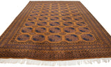Vintage Pakistani Ersari carpet, showing plush pile, geometric border, and cream fringe.
