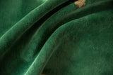 Emerald green short pile texture with soft undulations of a Nichols Art Deco carpet.