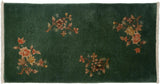 Carved rust and ivory floral spray, embossed dark oxidized green Nichols rug corner.