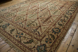 Traditional Vintage Agra carpet corner, showcasing ivory field, wine red trellis, and floral border.