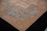 Ornate Art Deco floral spray of blush, celadon, silver on dusty apricot field.