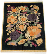 Art Deco carpet with white fringe, gold border, and striking mauve starburst flower.