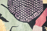 Art Deco carpet detail shows black and mauve floral, oxidized copper green, and raspberry.