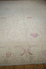 Angled view across the soft pile showing ivory and pale raspberry floral bouquets.