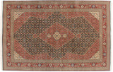 Vintage Tabriz design carpet with a navy Herati field, a scalloped red medallion, and floral borders.