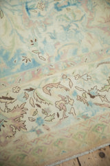 Detail showing the even wear and soft, abraded colors of the Polonaise design carpet.